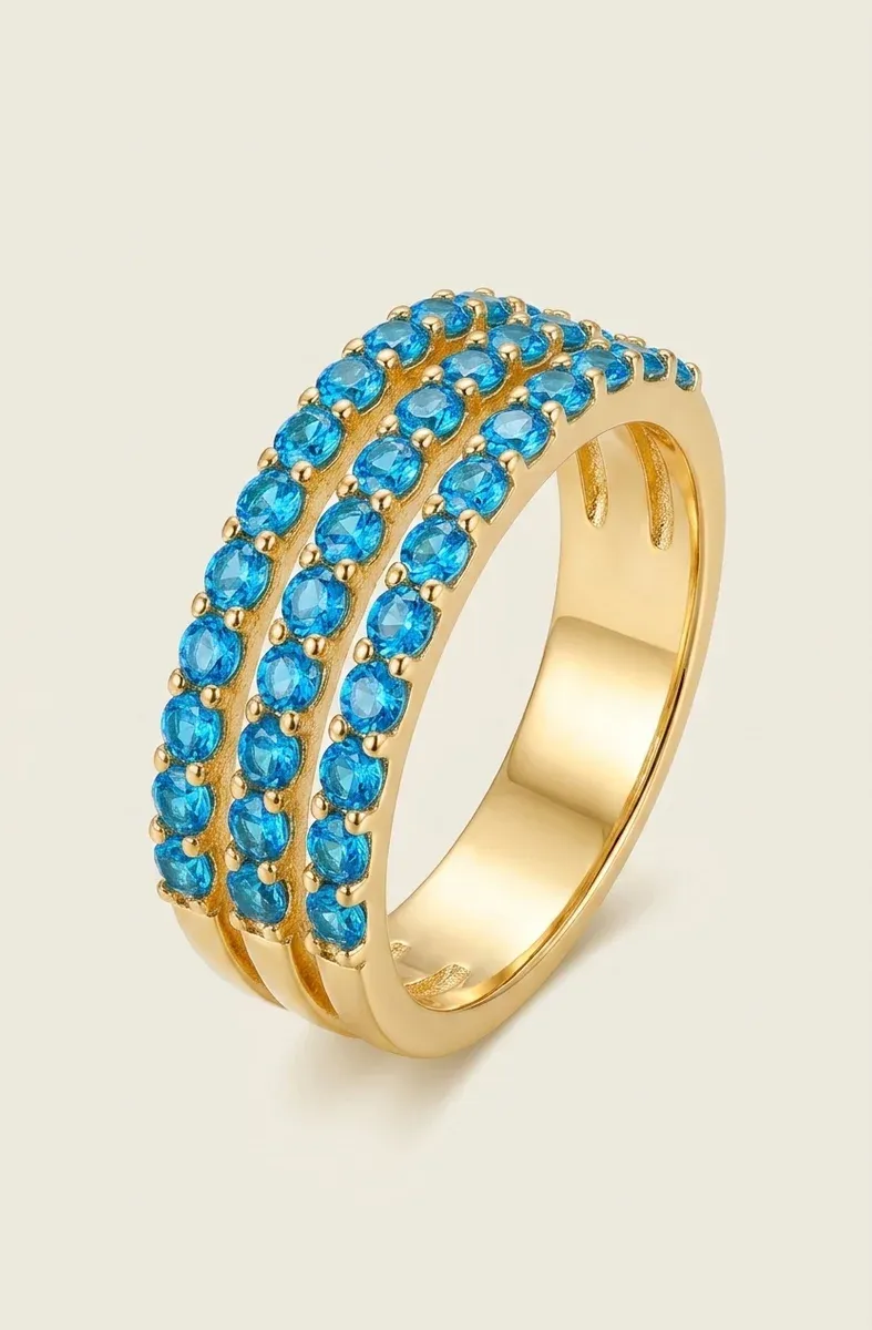 Verstellbarer Goldring mit blauem Zirkonia